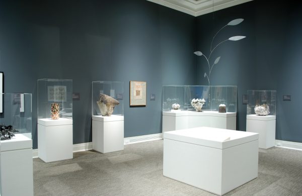 Art museum gallery showing Japanese ceramics and paintings