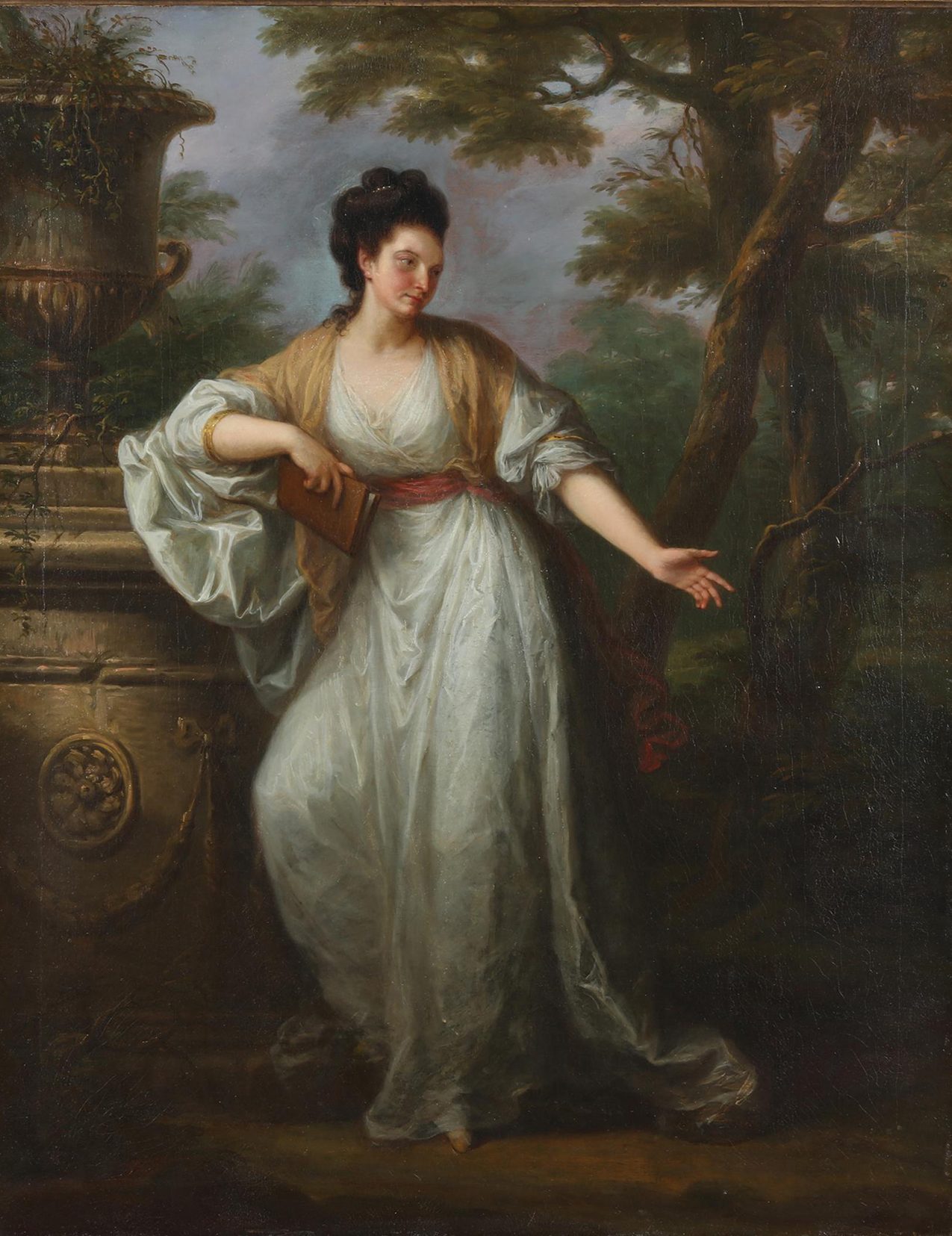 A woman with dark hair, light skin, and a white dress stands by an urn in a garden